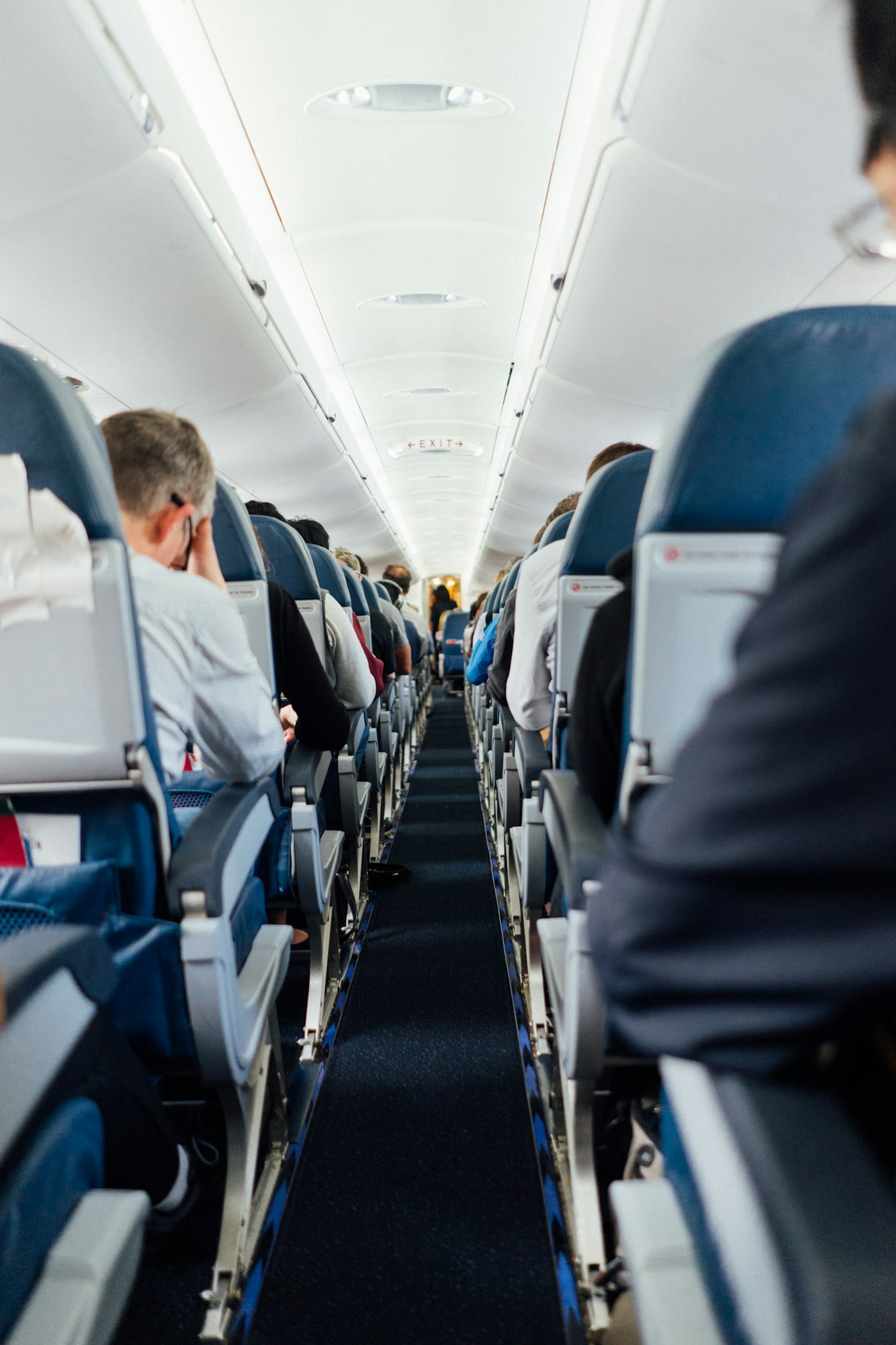 Airplane cabin seats viewed from the aisle