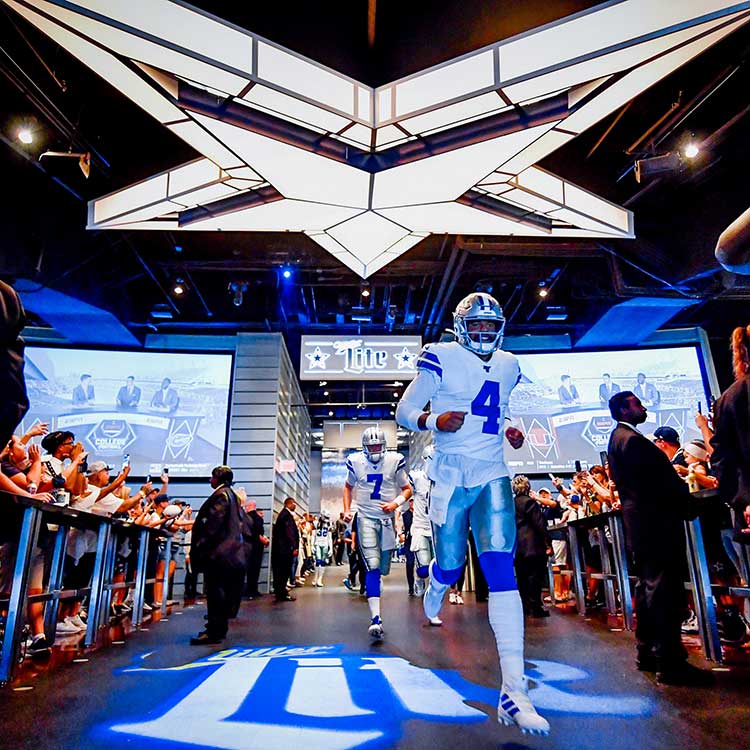 A group taking part in a skills challenge at AT&T Stadium