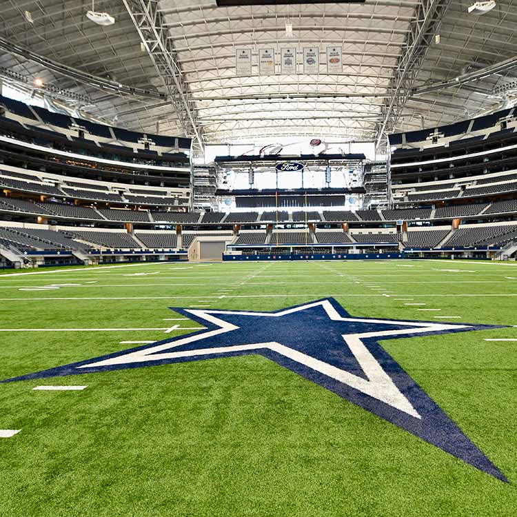 Empty football field inside AT&T Stadium