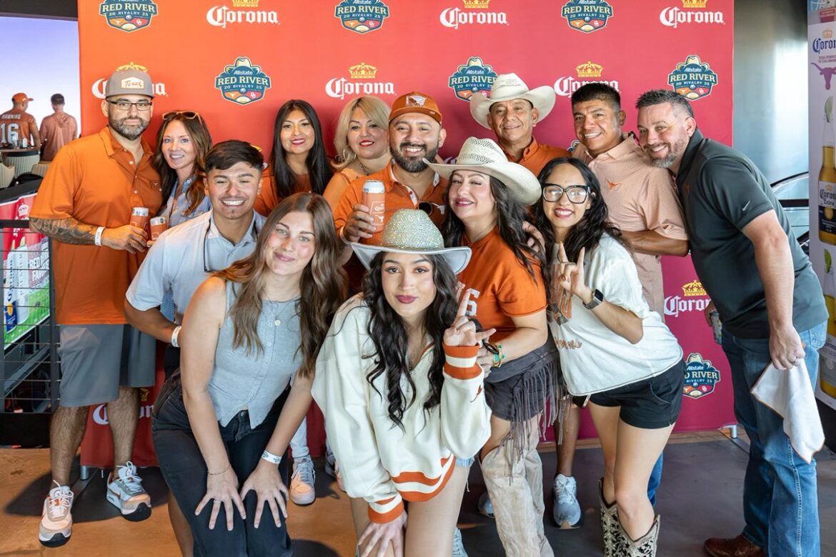 Fans experiencing college football inside Cosm Dallas