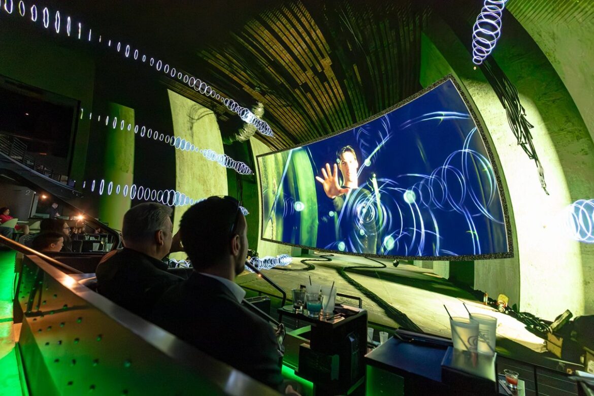 Audience watching The Matrix in a shared-reality venue at Cosm Dallas