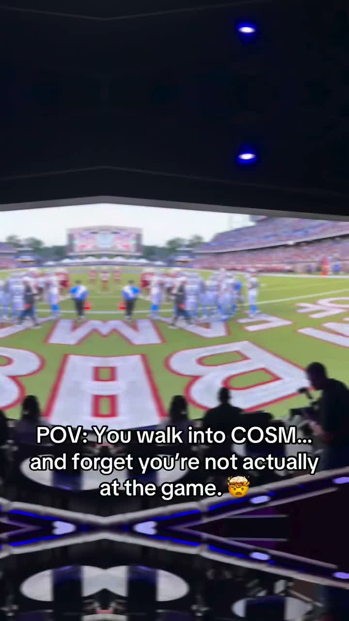 Guests enjoying an event inside a Cosm venue