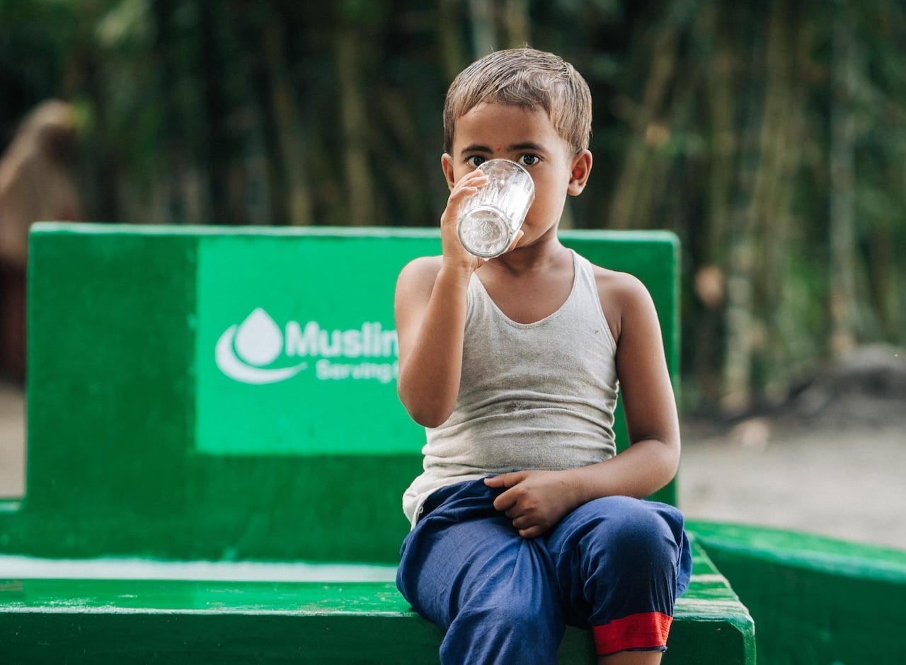 A child drinking water in a scene from Muslim Aid's Sadaqah Jariyah appeal