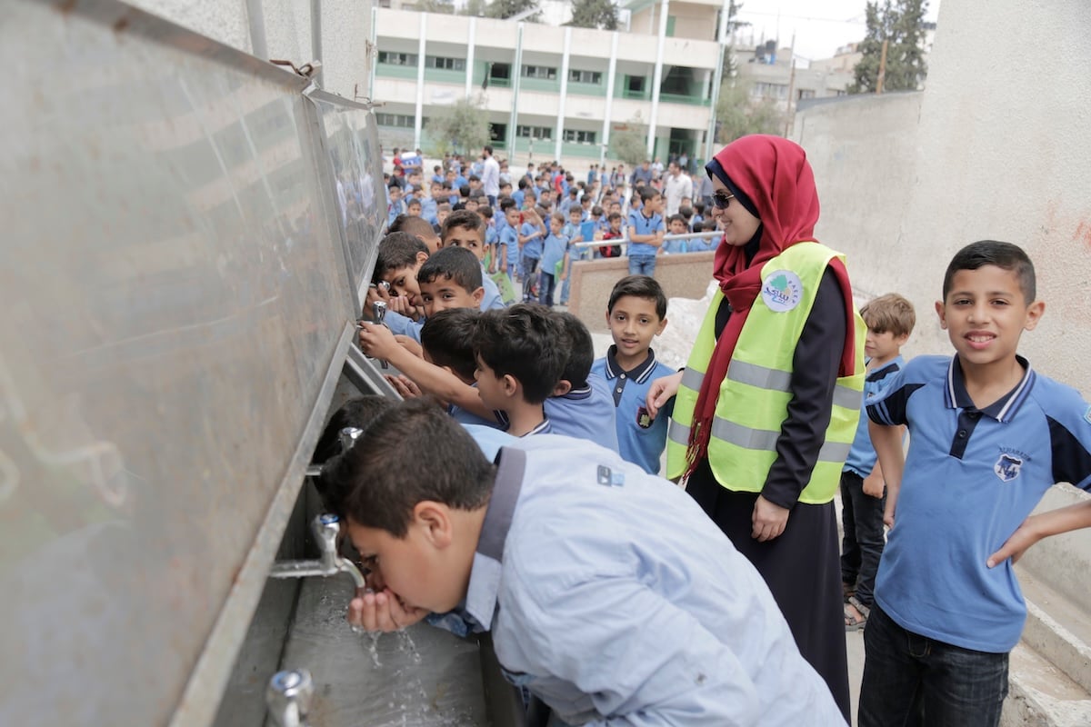 People and clean water infrastructure supported by Muslim Aid