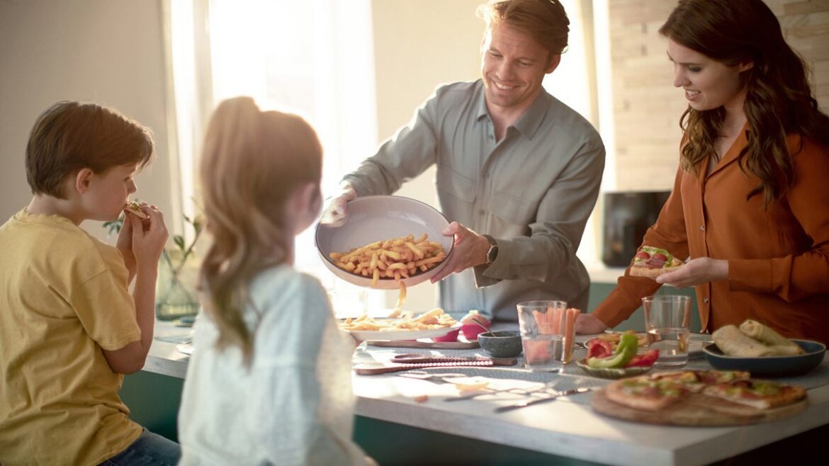 Family eating together in a kitchen