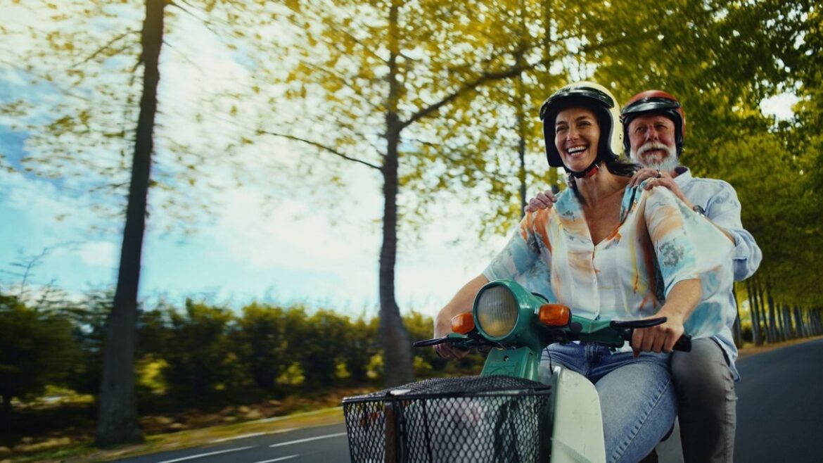 Traveller riding a moped on holiday