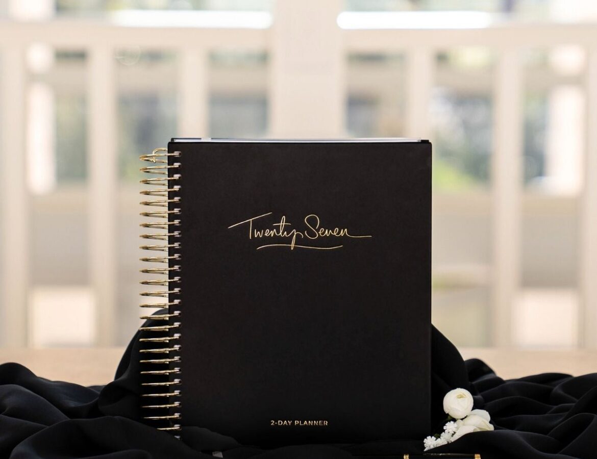 Black 2027 2-Day Planner with gold lettering