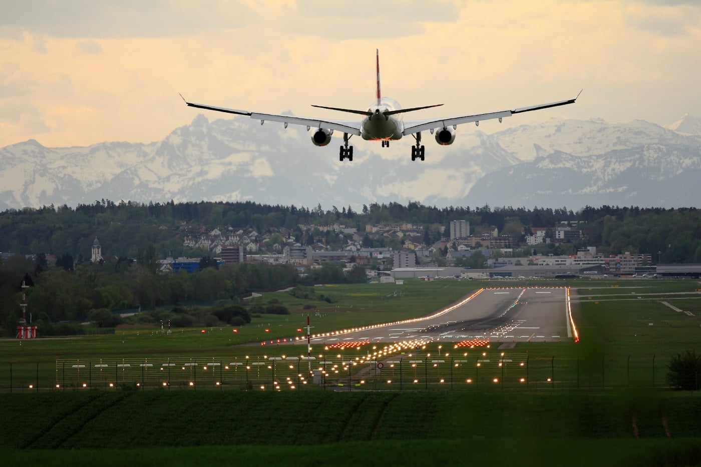 Airplane landing over an airport runway