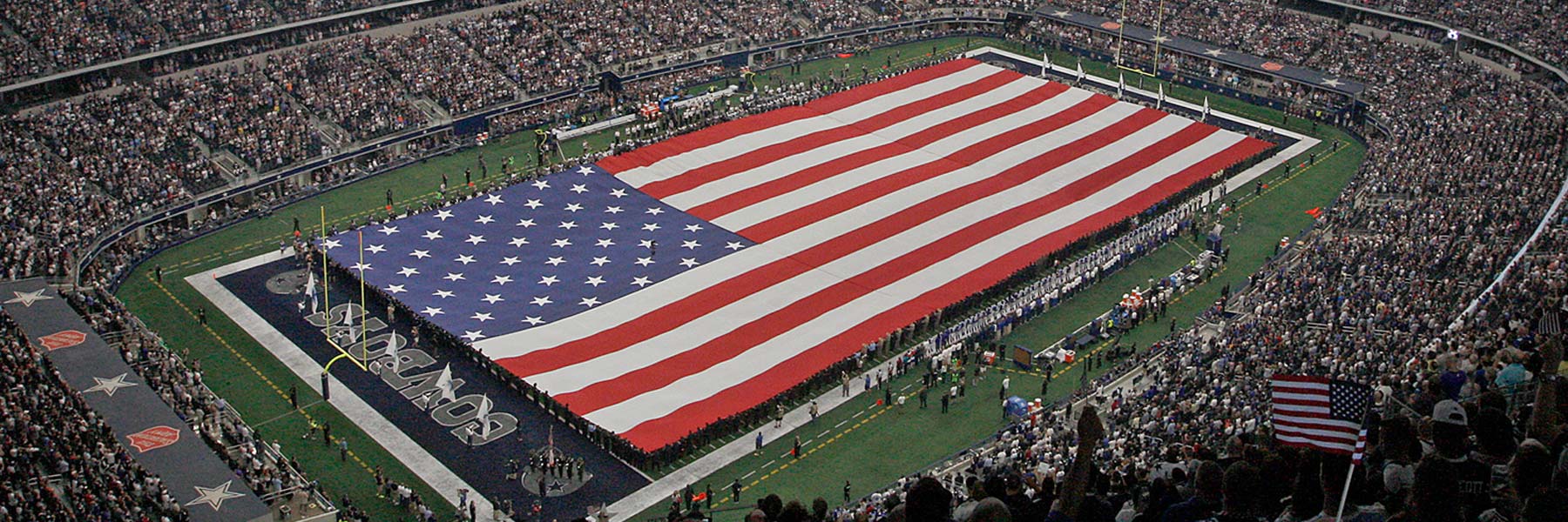 The football field at AT&T Stadium beneath its large video board