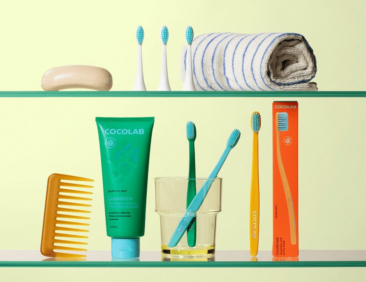 Colorful Cocofloss dental care products arranged in a bright lifestyle scene