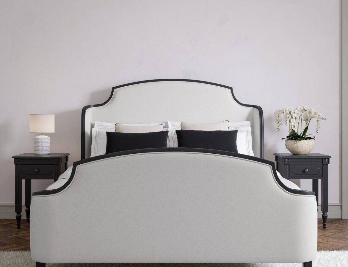Evangeline bed in natural and black upholstery styled in a bedroom