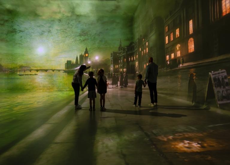 A family viewing a London projection at Frameless