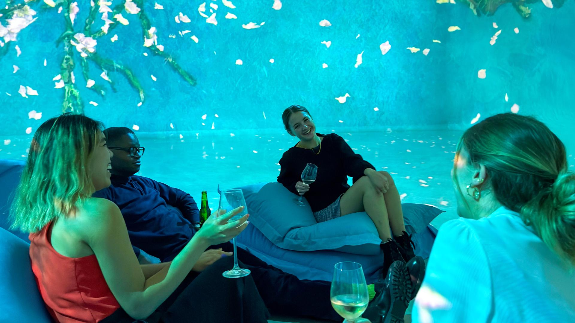 Friends enjoying an after-dark gallery visit at Frameless Lates