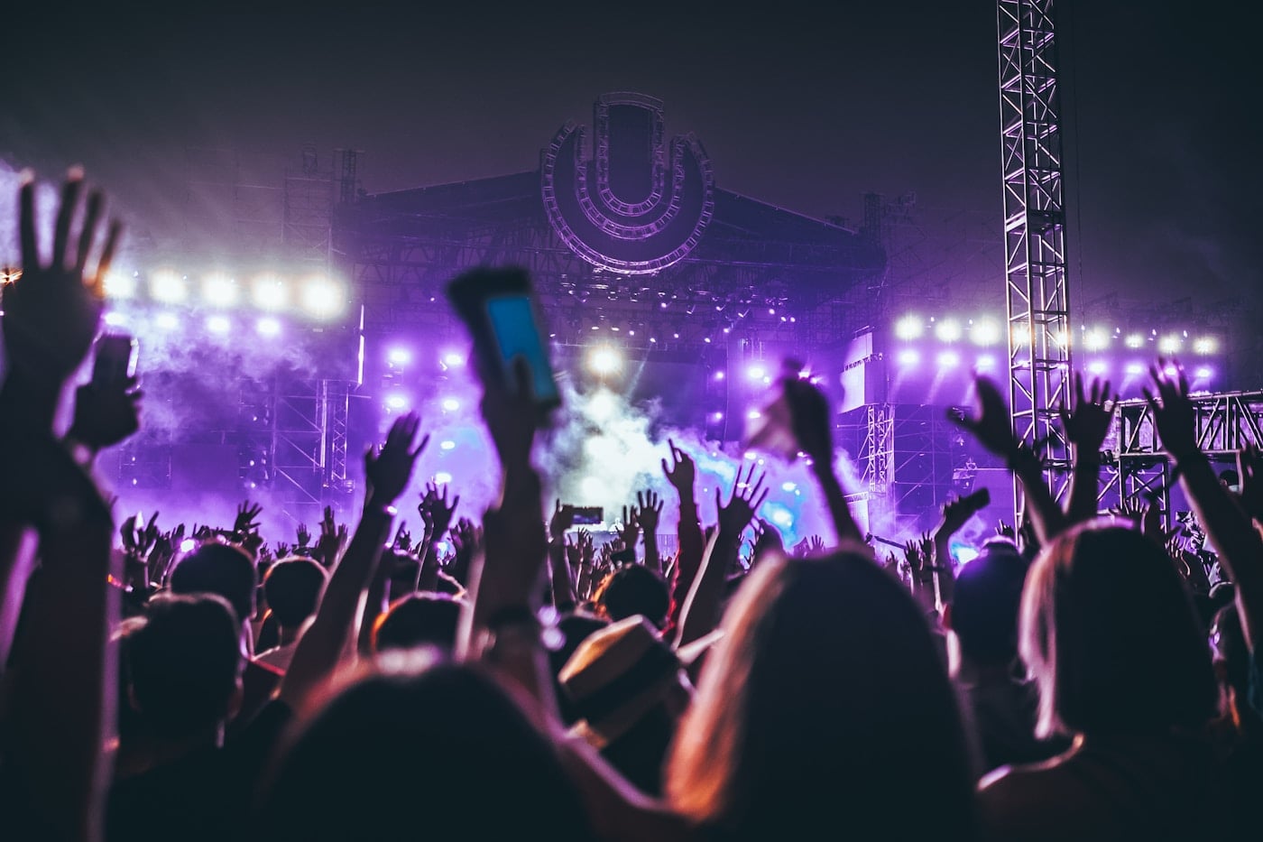 Guitarist performing live under stage lights