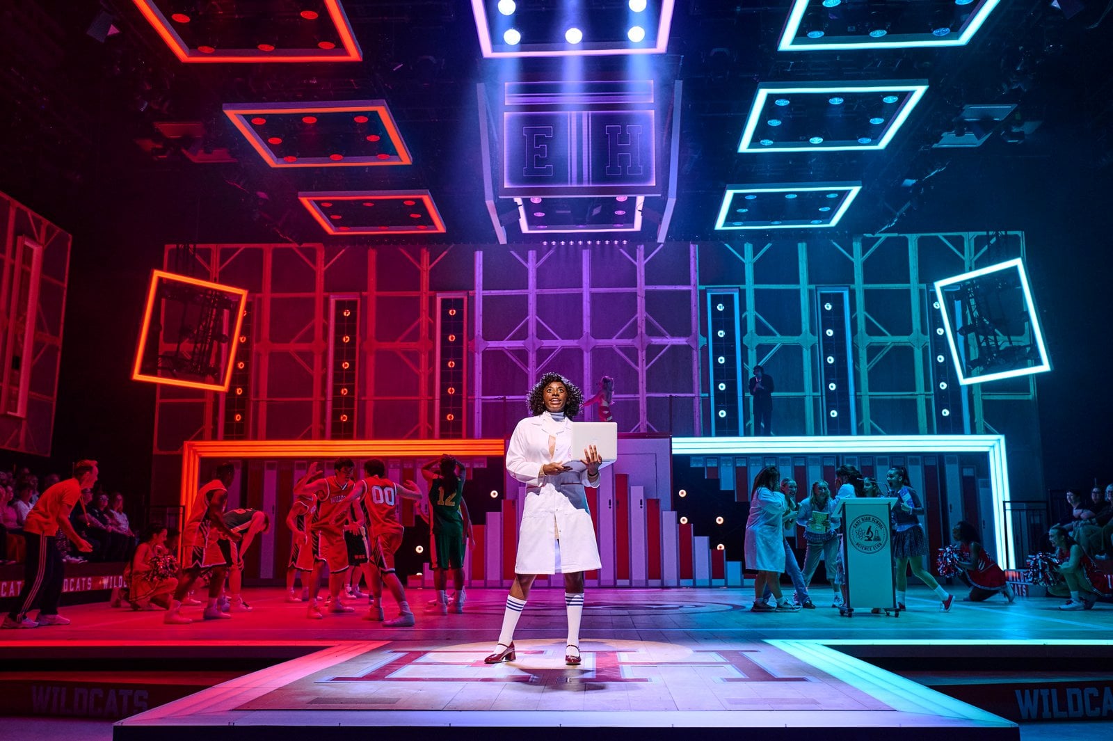 High School Musical performers in a colourful stage moment
