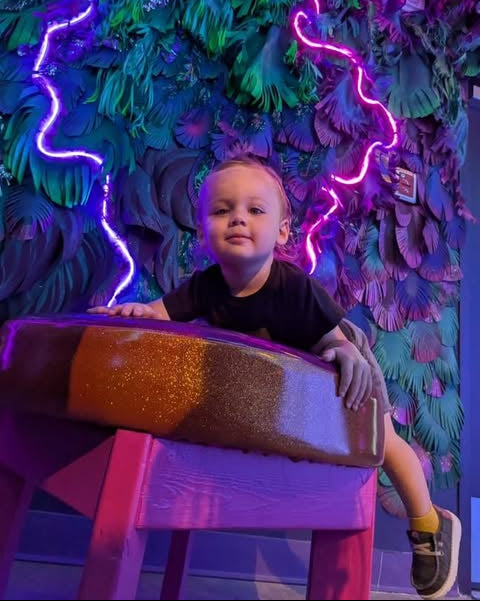 Child exploring a colorful Jamnola installation