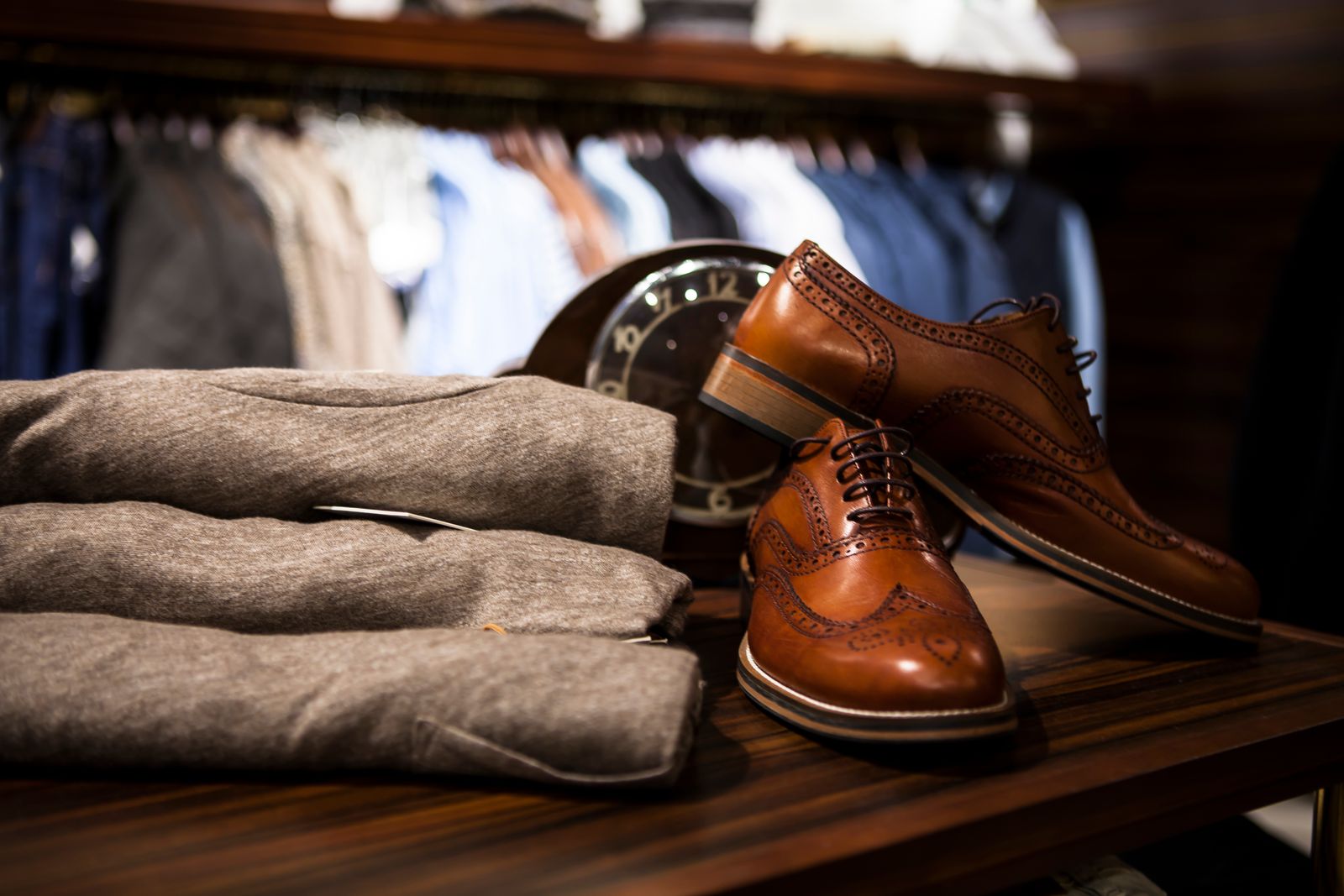 Leather shoes and folded clothes