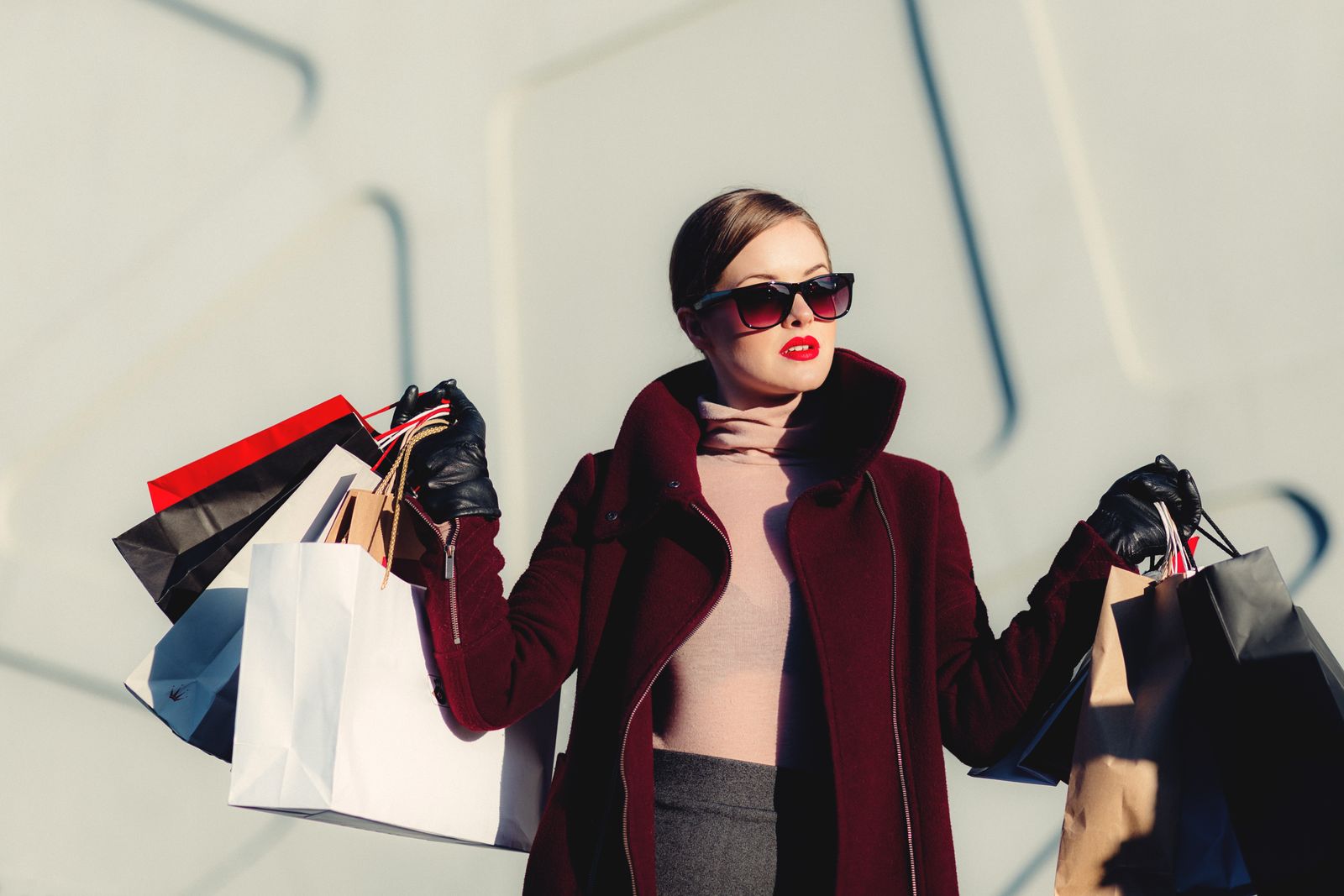 Model in a red editorial fashion outfit