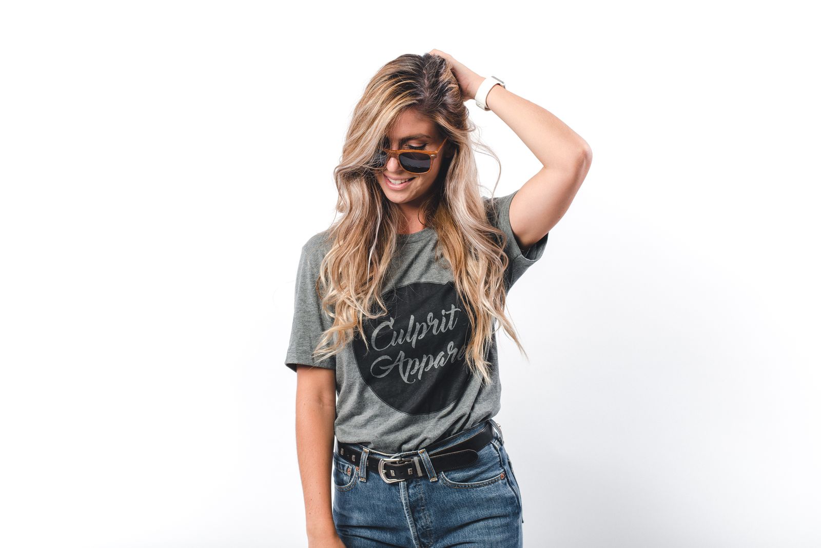 Woman wearing sunglasses and jeans