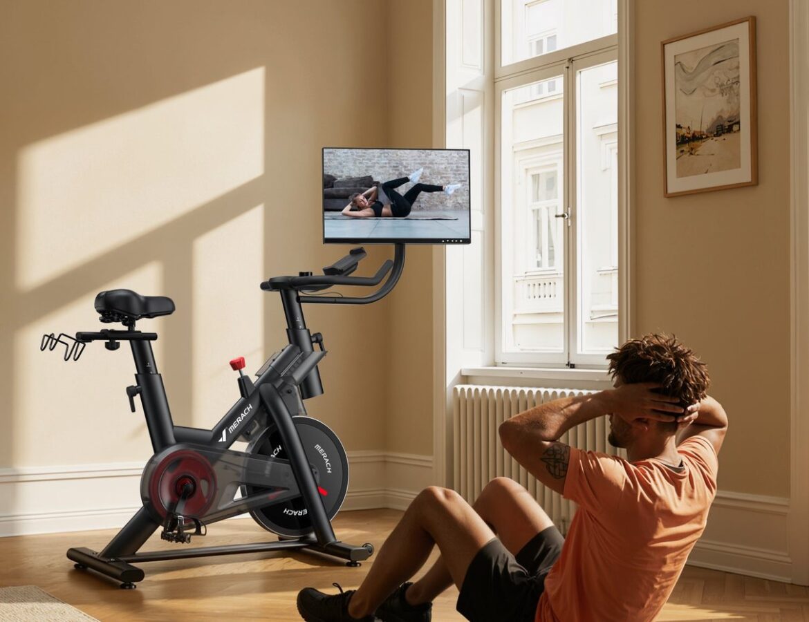Merach S29R3 exercise bike with rotating screen in a home setting