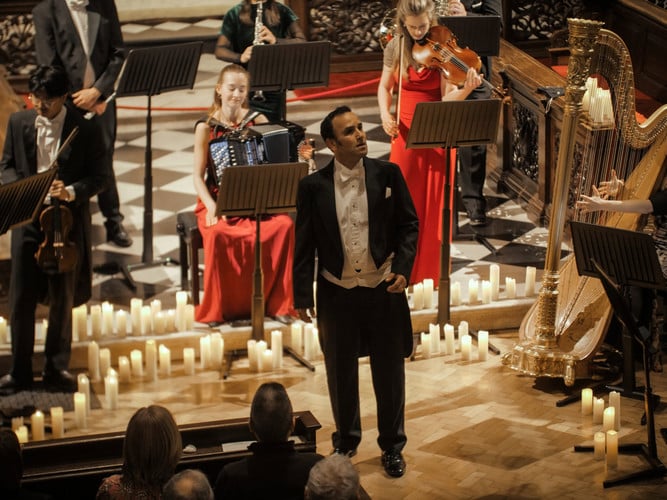 Soloist performing at a candlelit opera concert