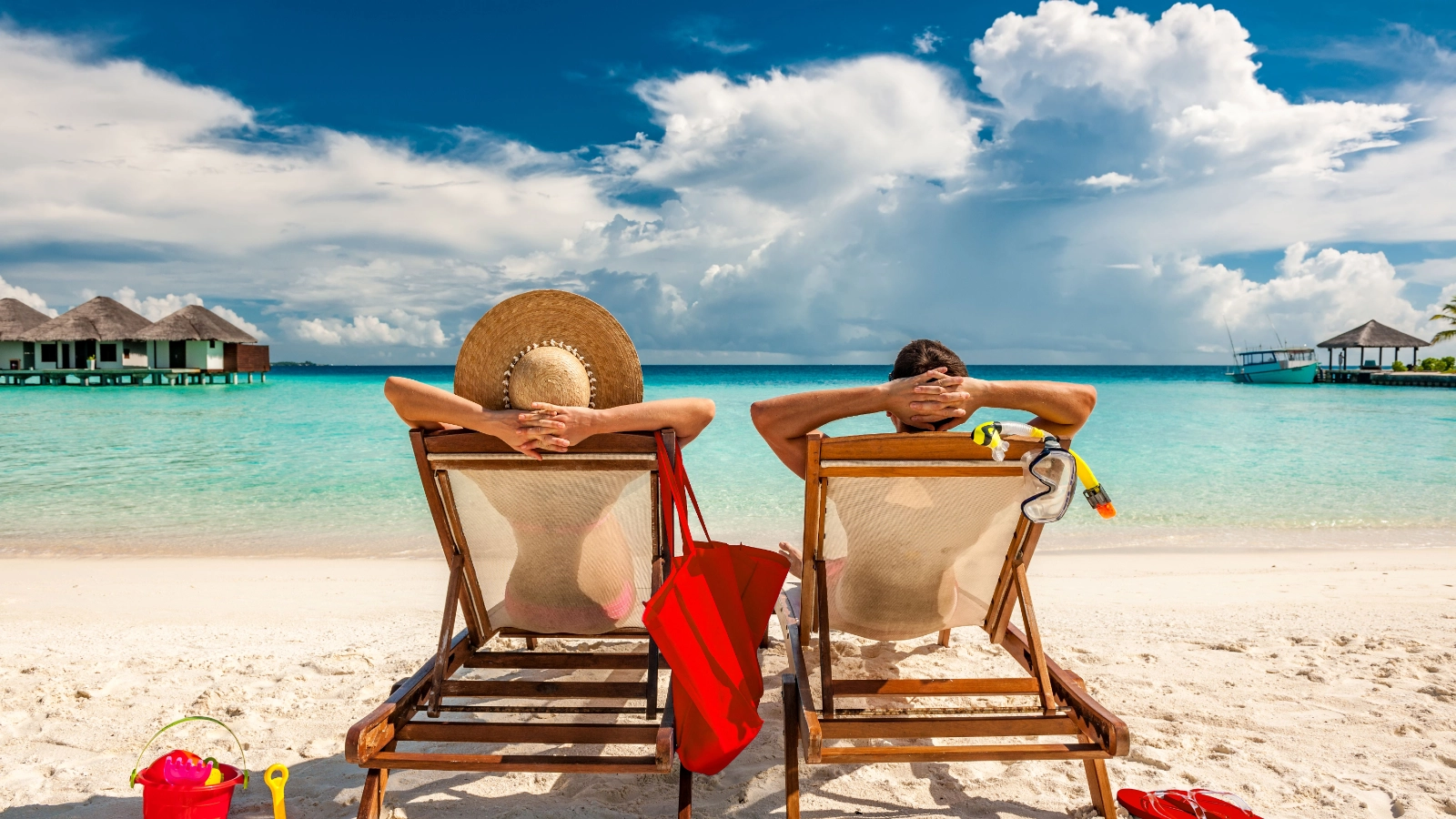Two people relaxing on a tropical beach