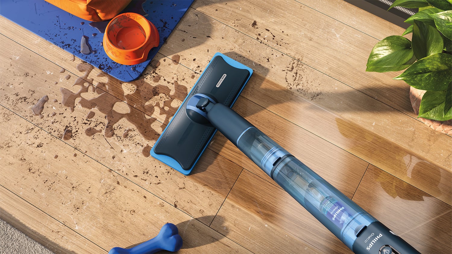Philips cordless floor cleaner picking up pet hair and crumbs from a wooden floor