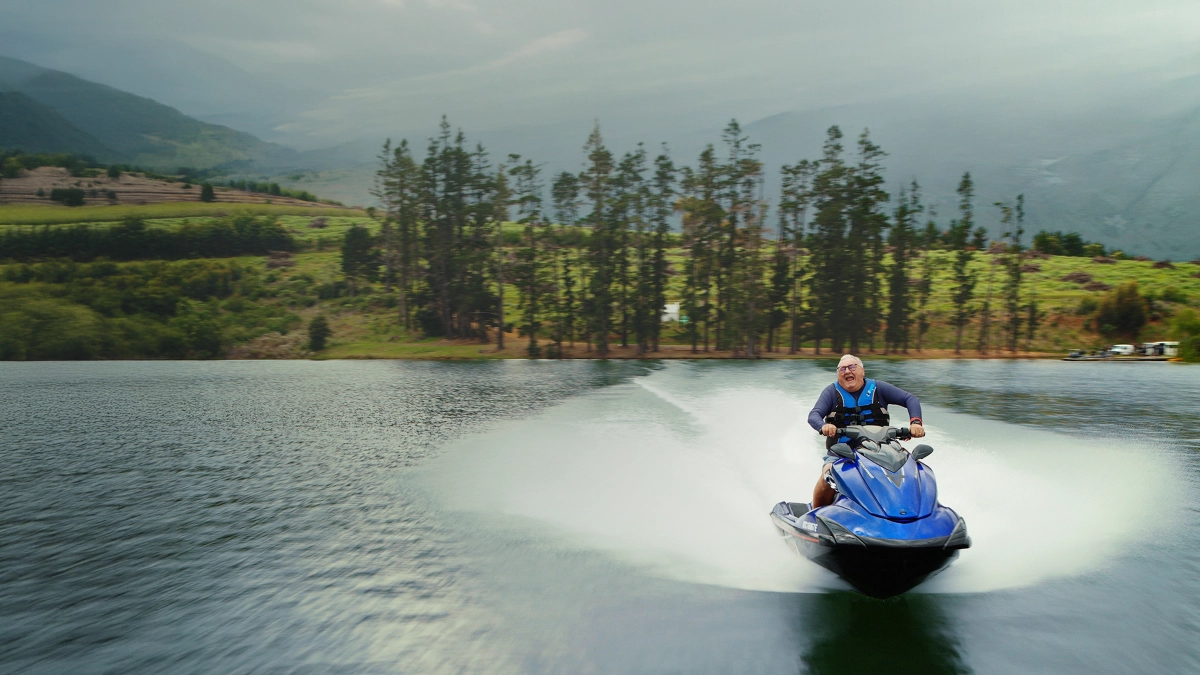Traveller enjoying a jetski on blue water