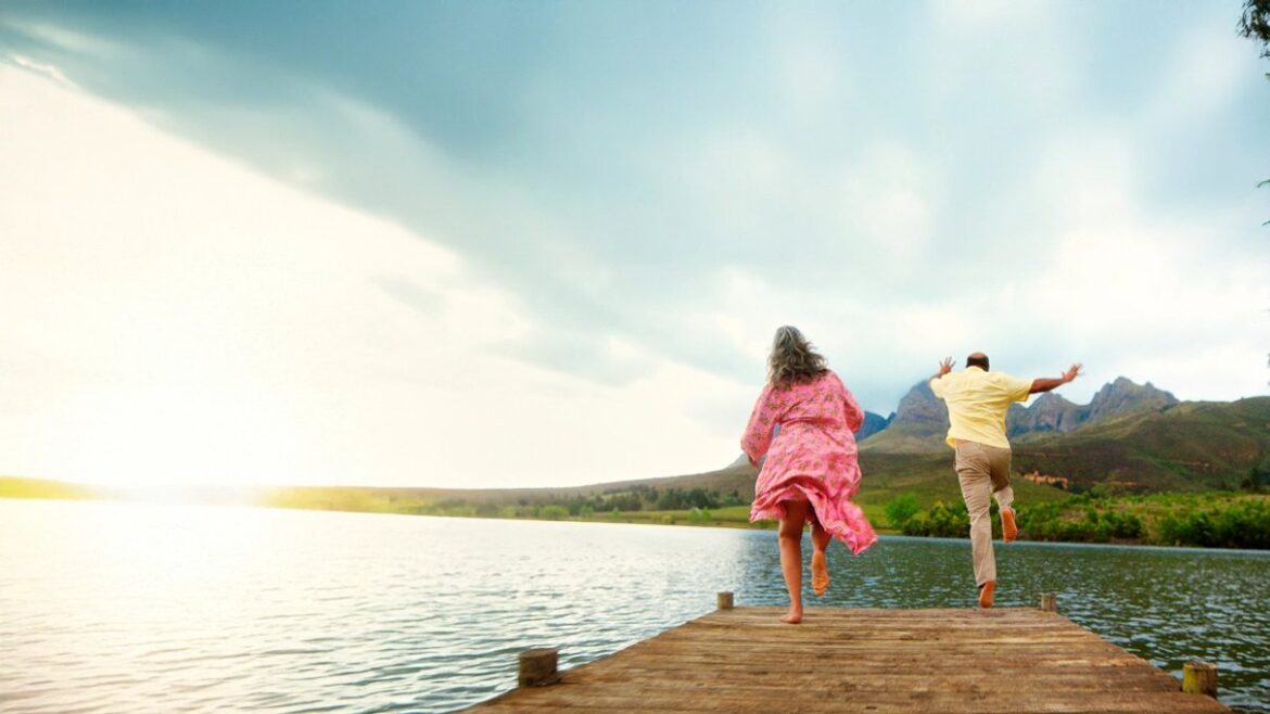 Two people running on pier