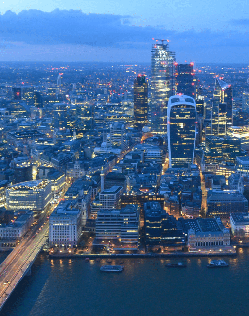 London skyline glowing at night from The View from The Shard