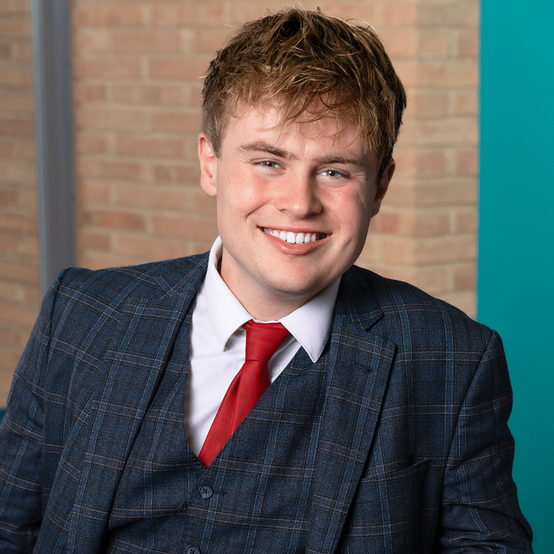 Portrait of a suited young man at The View from The Shard