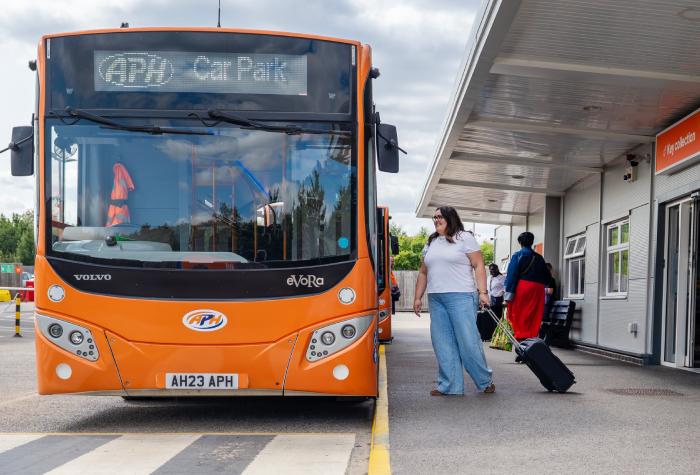 APH shuttle bus at a Gatwick airport parking transfer stop