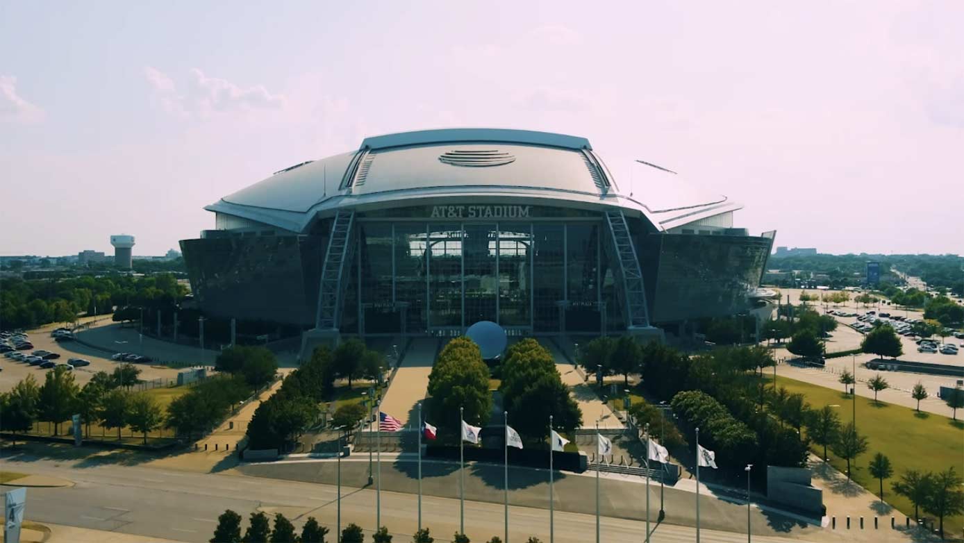 Visitors inside AT&T Stadium during a tour