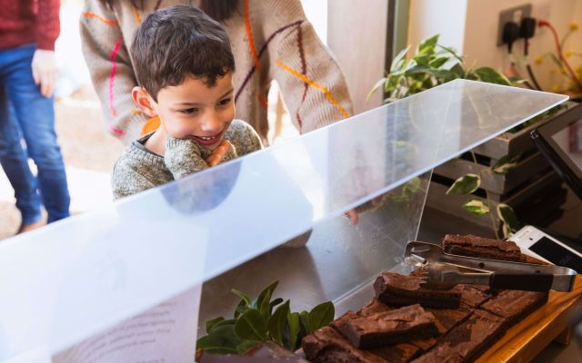 A child beside a food display at Blenheim Palace