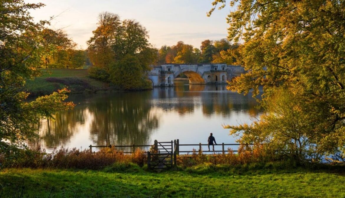 Lakeside park with a bridge at Blenheim Palace