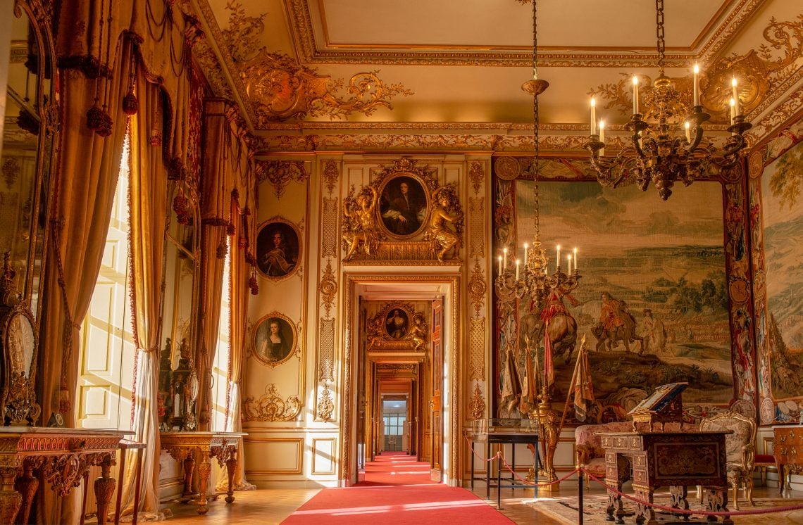 State room interior with tapestries and chandelier at Blenheim Palace