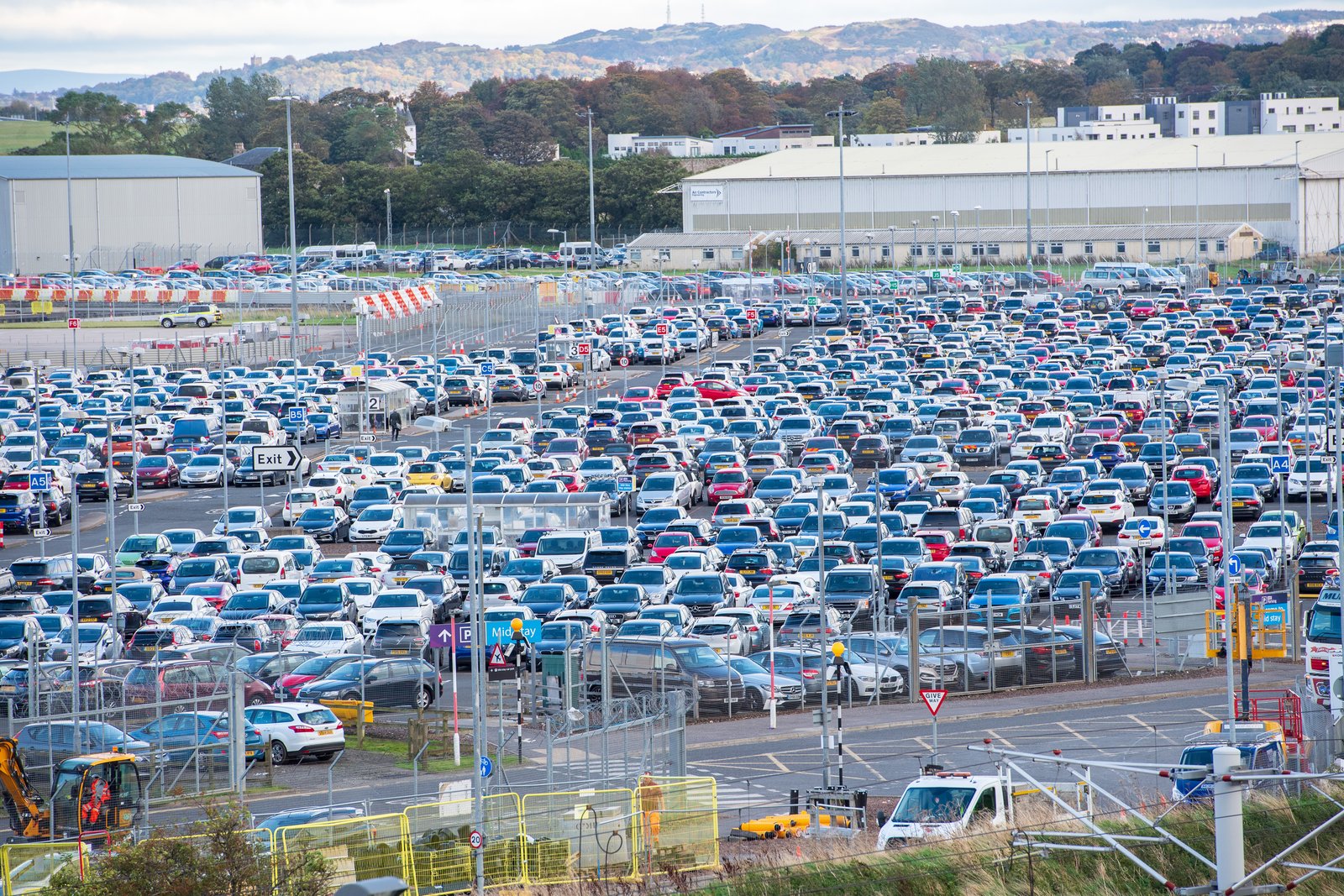 Rows of cars in a large Edinburgh Airport car park