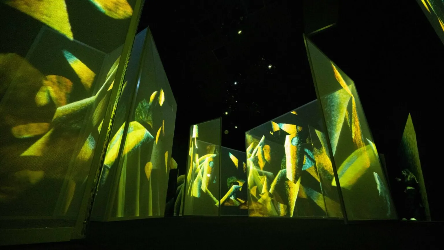 A large abstract composition is projected in The Art of Abstraction