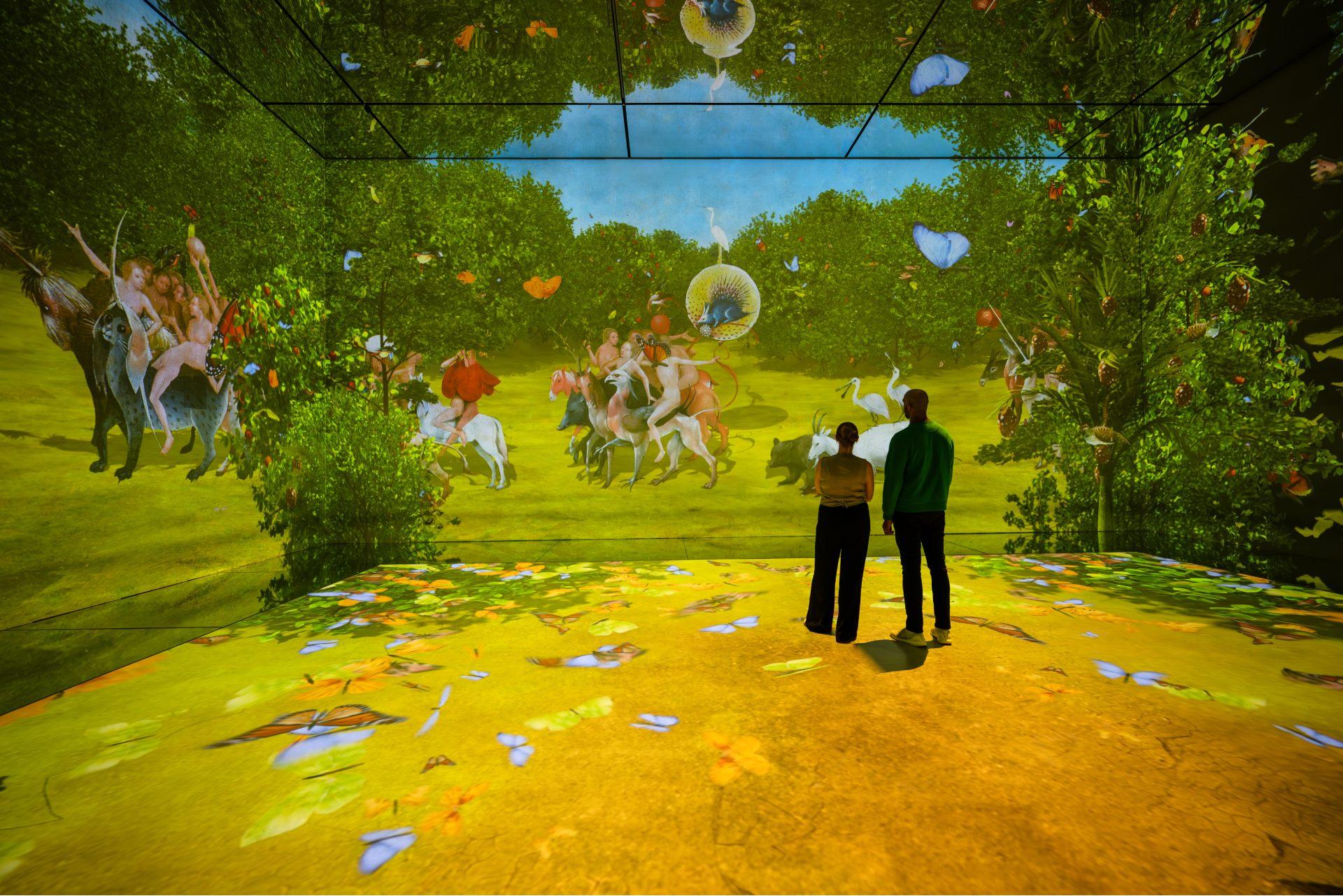 Visitors moving through the immersive Frameless experience
