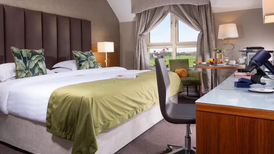 Executive double room at Castleknock Hotel with a bed and desk