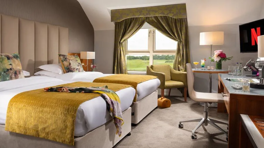 Superior twin bedroom at Castleknock Hotel with two beds and a window seating area