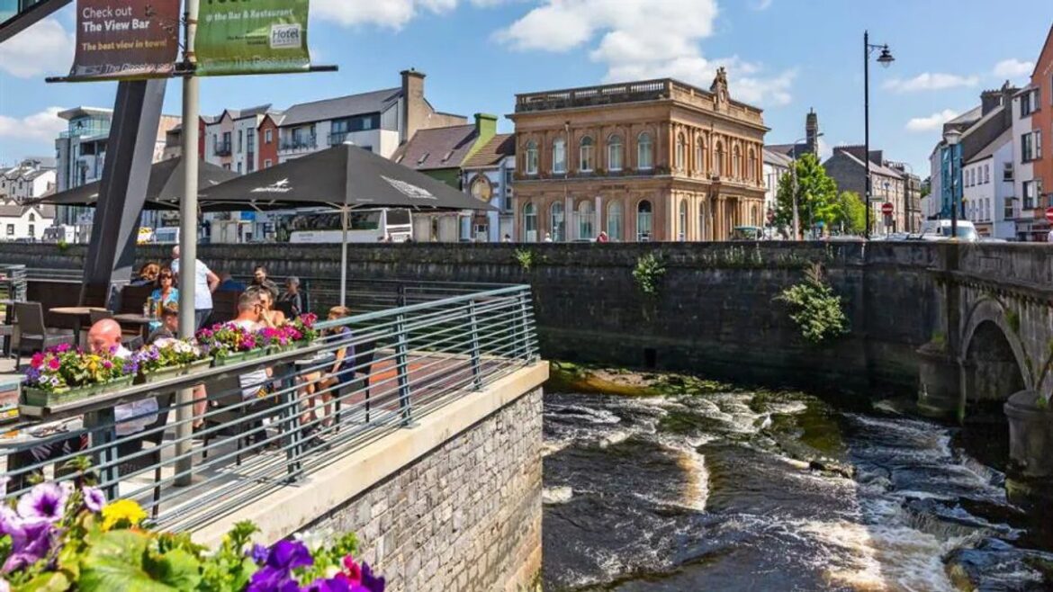 A riverside restaurant patio beside the water