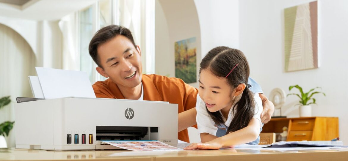 A father and child using an HP Smart Tank printer at home