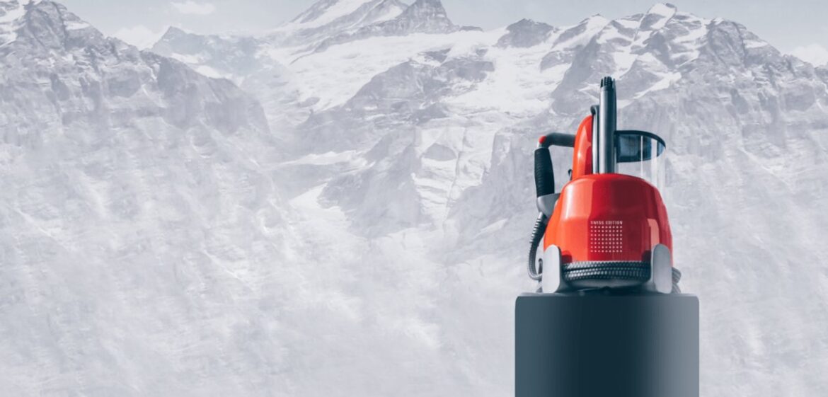 Red Laurastar steam cleaner against a mountain backdrop