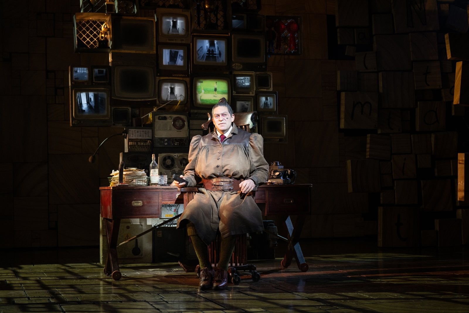 Matilda with cast members on stage during the musical