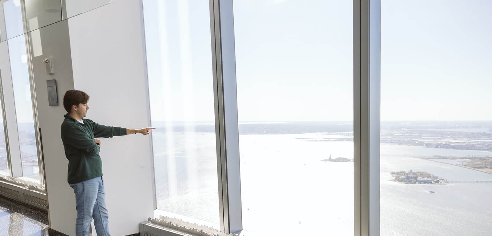 Visitors looking over the city from the observatory windows
