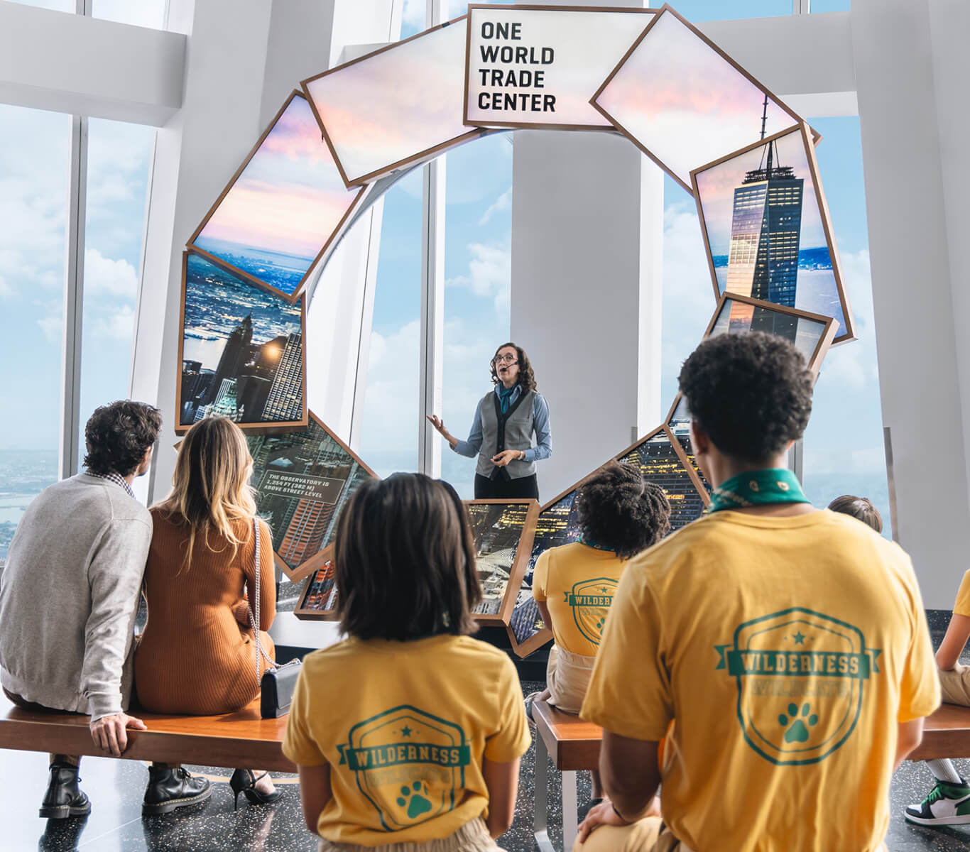 Visitors looking across Manhattan from One World Observatory
