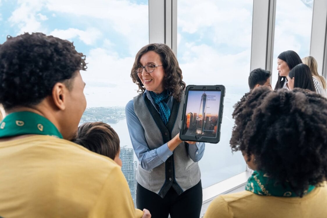Guide speaking to visitors at One World Observatory