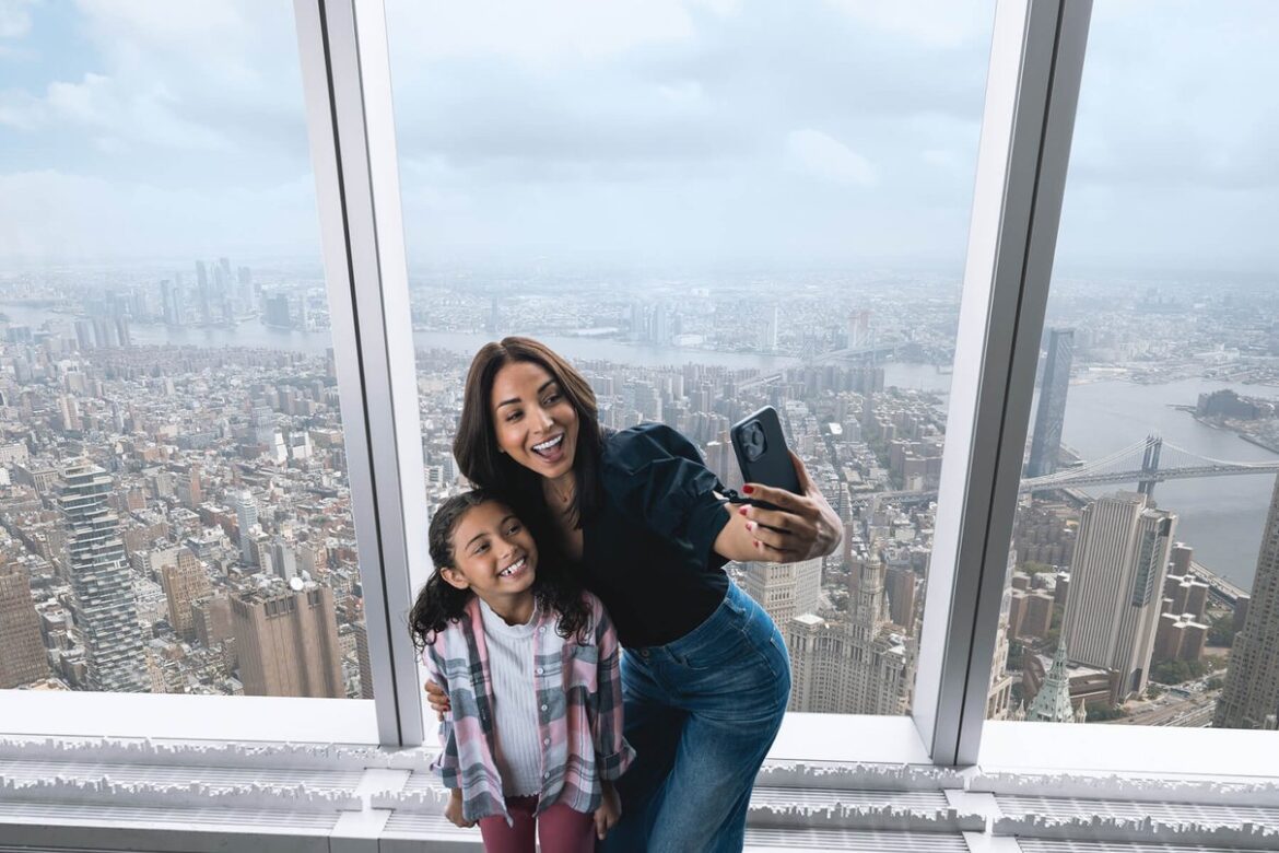 Visitors looking across the New York skyline from the observatory