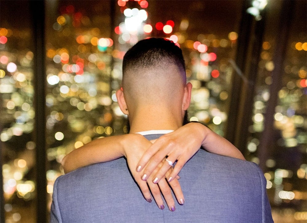 A couple celebrating a proposal at The Shard